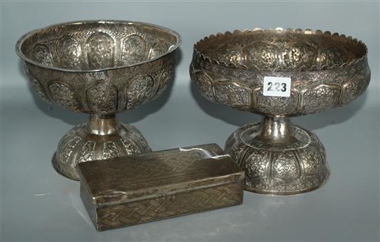 Two Indian embossed plated pedestal bowls and a cigarette box